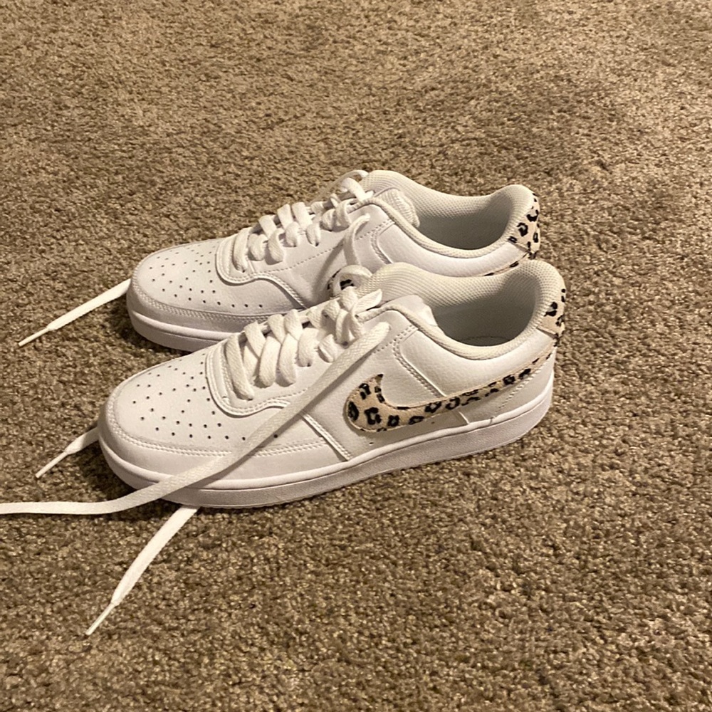 Nike tennis shoes with animal print swosh. NWOT